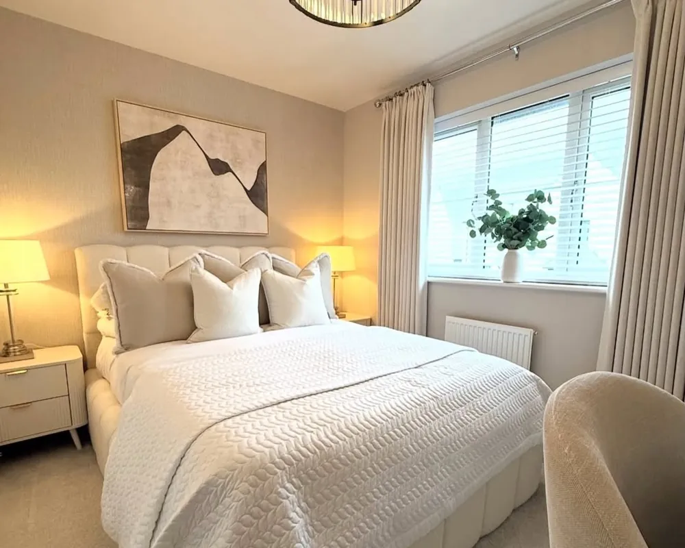 A bedroom after cleaning: bed made with fresh linens and surfaces dusted